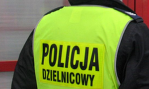 napis na żółtej kamizelce Policja dzielnicowy